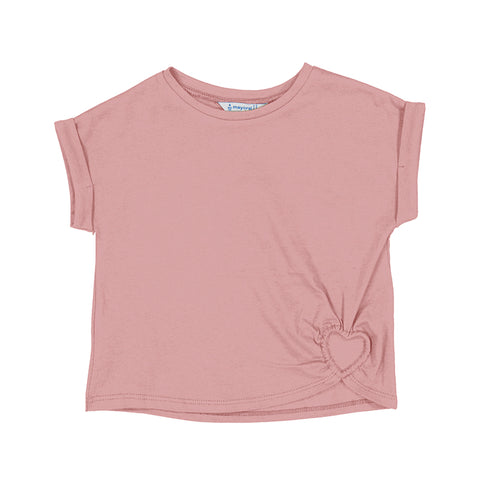 blush colored shirt with a heart cut out at the bottom of the shirt.