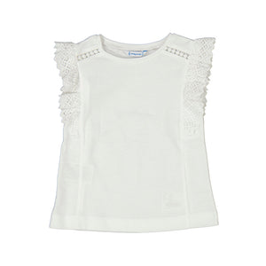 white shirt with lacy ruffle sleeves. 