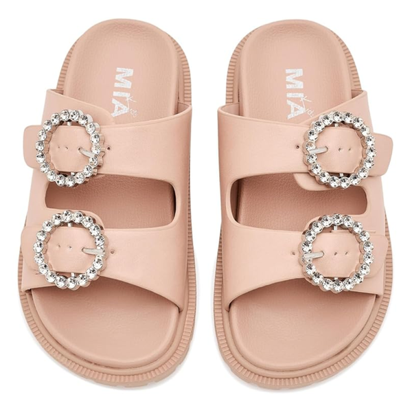 Blush pink girls slide sandal with oversized crystal buckle and textured lug sole.