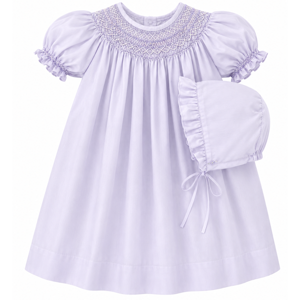 Smocked Lavender baby dress with matching bonnet on a white background