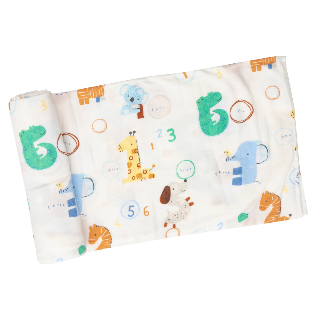 white blanket with animals and numbers