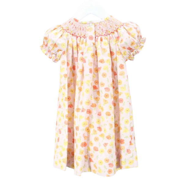 Back of a pink floral bishop dress with button closure and smocking detail.
