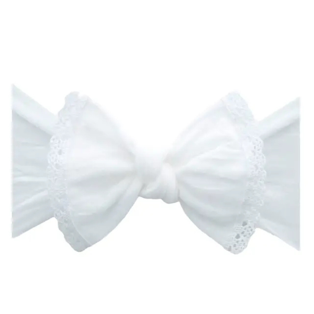 White bow with lace details on a white background