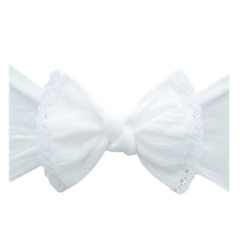 White bow with lace details on a white background
