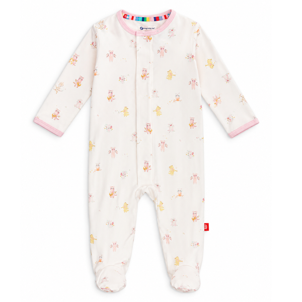 A baby onesie with animals playing instruments with a light pink background. 
