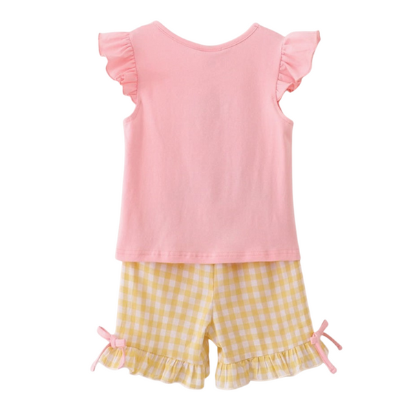 Back view of the pink flutter sleeve top paired with yellow gingham ruffle shorts featuring pink bow accents.