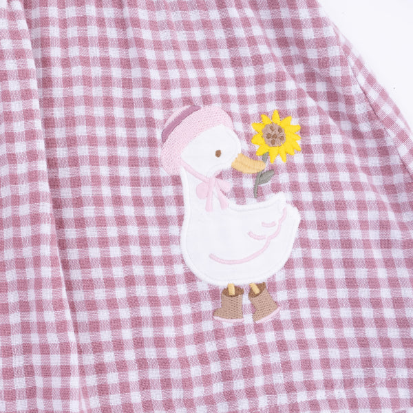 closeup of goose embroidery on a girls top