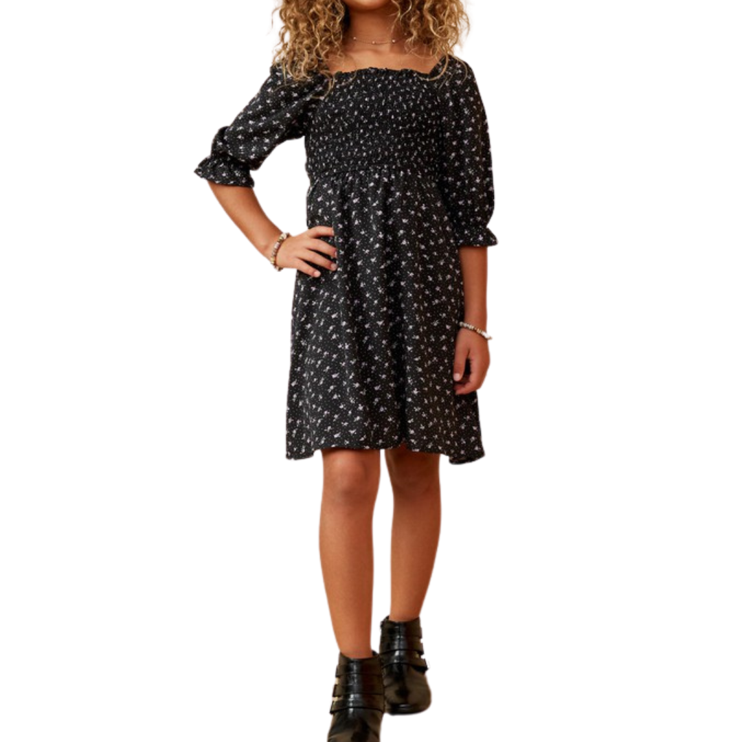 Black smocked square neck dress with 3/4 length sleeve and a floral ditsy print