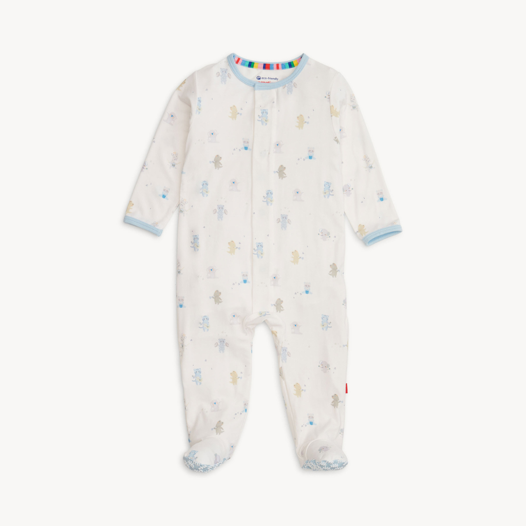 Baby wearing a soft TENCEL™ modal footie sleeper with magnetic closures and fold-over mittens for cozy, all-day comfort.
