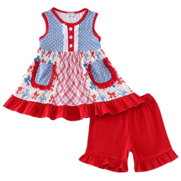 girls’ blue polka dot ruffle top with red bow print skirt and matching red ruffle shorts.