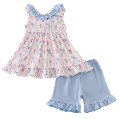 Two-piece outfit with ruffle-trim floral top and matching blue ruffle shorts—perfect for warm weather.