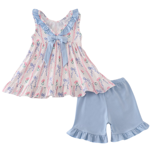 Girls' bow-back floral ruffle top paired with soft blue ruffle shorts, showing sweet detail and comfy fit.