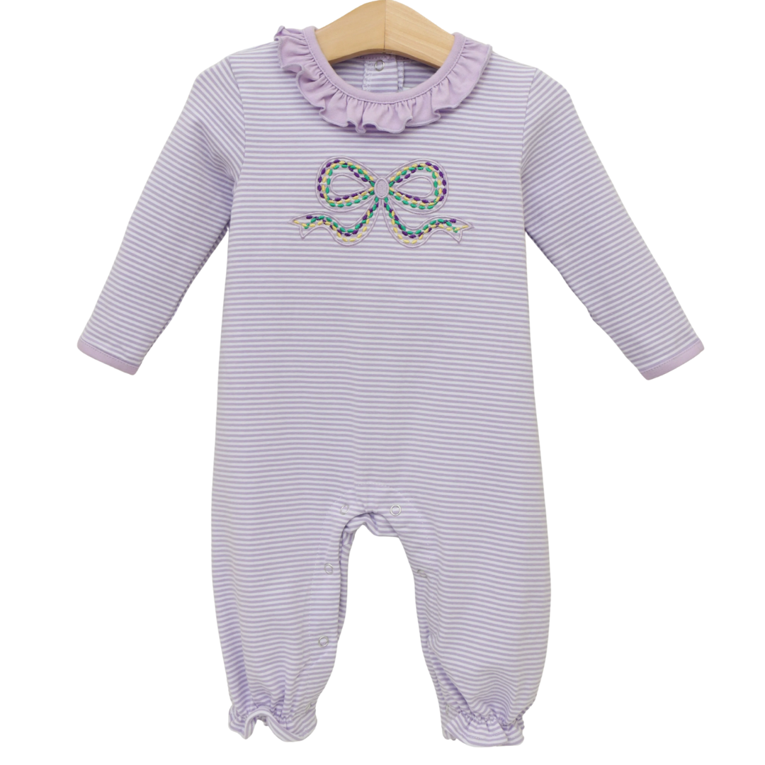 Lilac striped baby romper with long sleeves, ruffle neckline, and embroidered multicolor bow on a hanger against a white background.