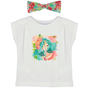 white t-shirt with a girl  with pink and orange floral on the front. has a matching teal and pink headband. 
