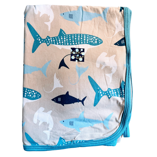 bamboo swaddling blanket burlap khaki color with blue, white and black sharks and other ocean life print