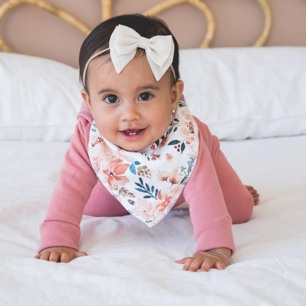 baby wearing a floral bandana bib