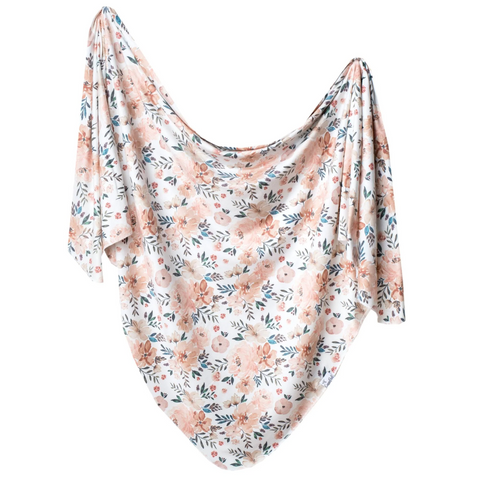 floral pattern in peaches and neutrals swaddling blanket