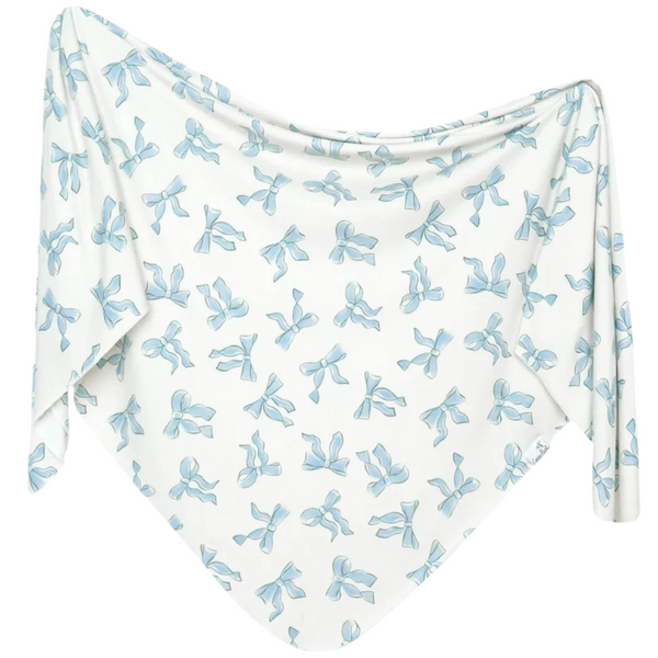 White fabric with blue bow pattern on a white background
