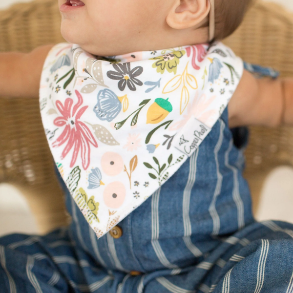 baby wearing a copper pearl floral bandana bib