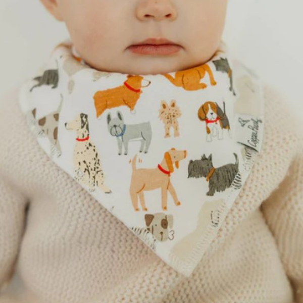 Baby wearing copper pearl dog themed bandana bib