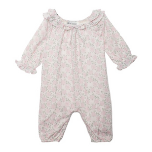 Front view of pink floral baby romper featuring ruffle collar, gathered neckline, and elasticized legs.