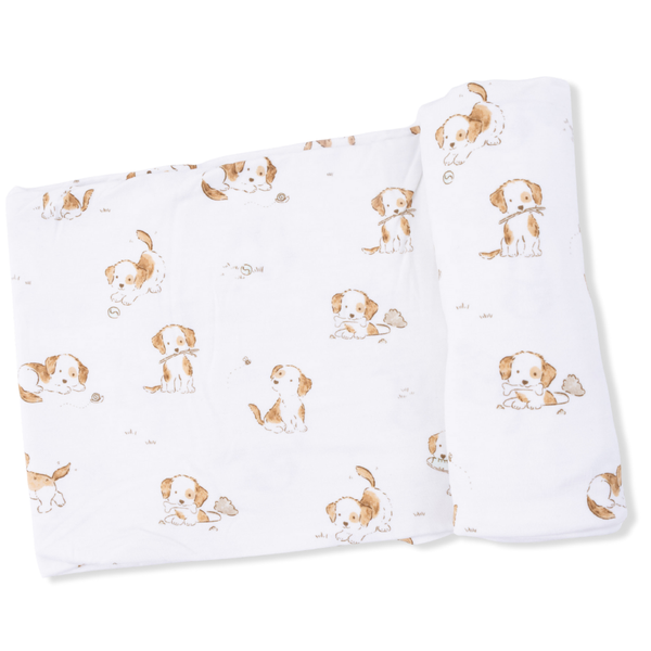 white swaddling blanket with a sweet brown and white puppy print.  Think The Poky Little Puppy