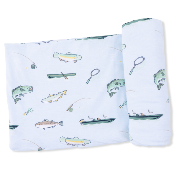 Swaddle blanket with fishing-themed design on a white background