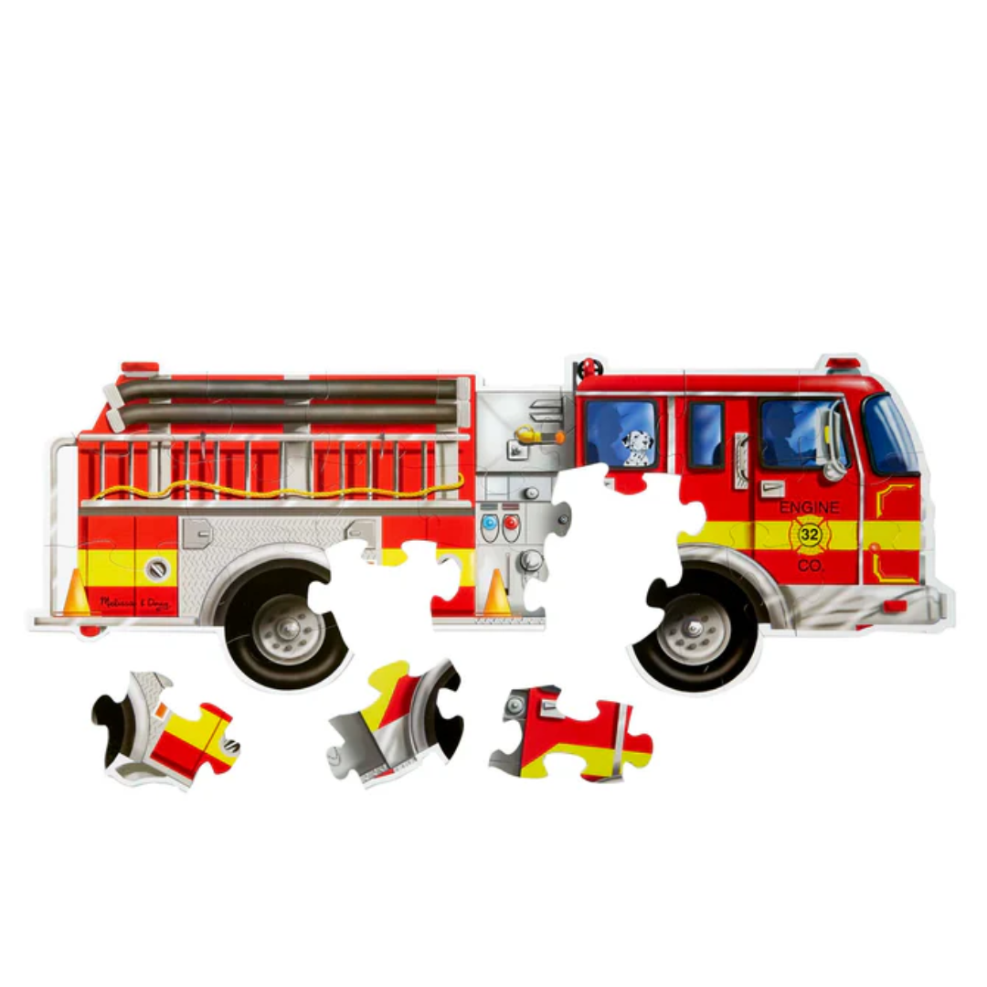 Giant floor puzzle of a bright red fire engine with large, sturdy pieces suitable for young children.