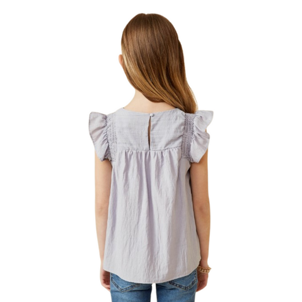 Back view of lavender top showing smocked shoulder accents and keyhole button closure.