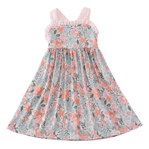 Girl's floral dress with pink gingham straps, ruffle-trim neckline, and gathered skirt in soft coral and green tones.