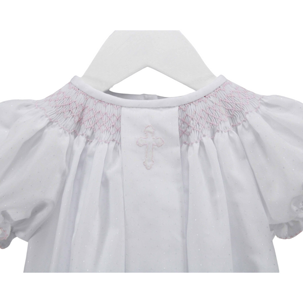 close up of the pink smocking on the dress
