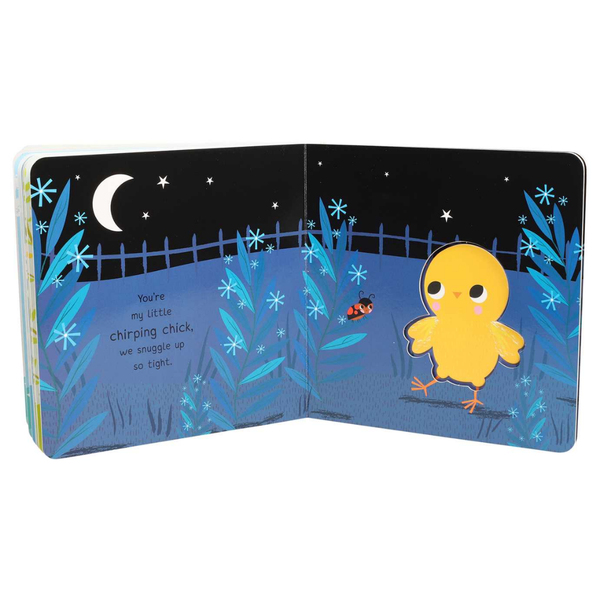 Open book with a yellow chick illustration on a night scene