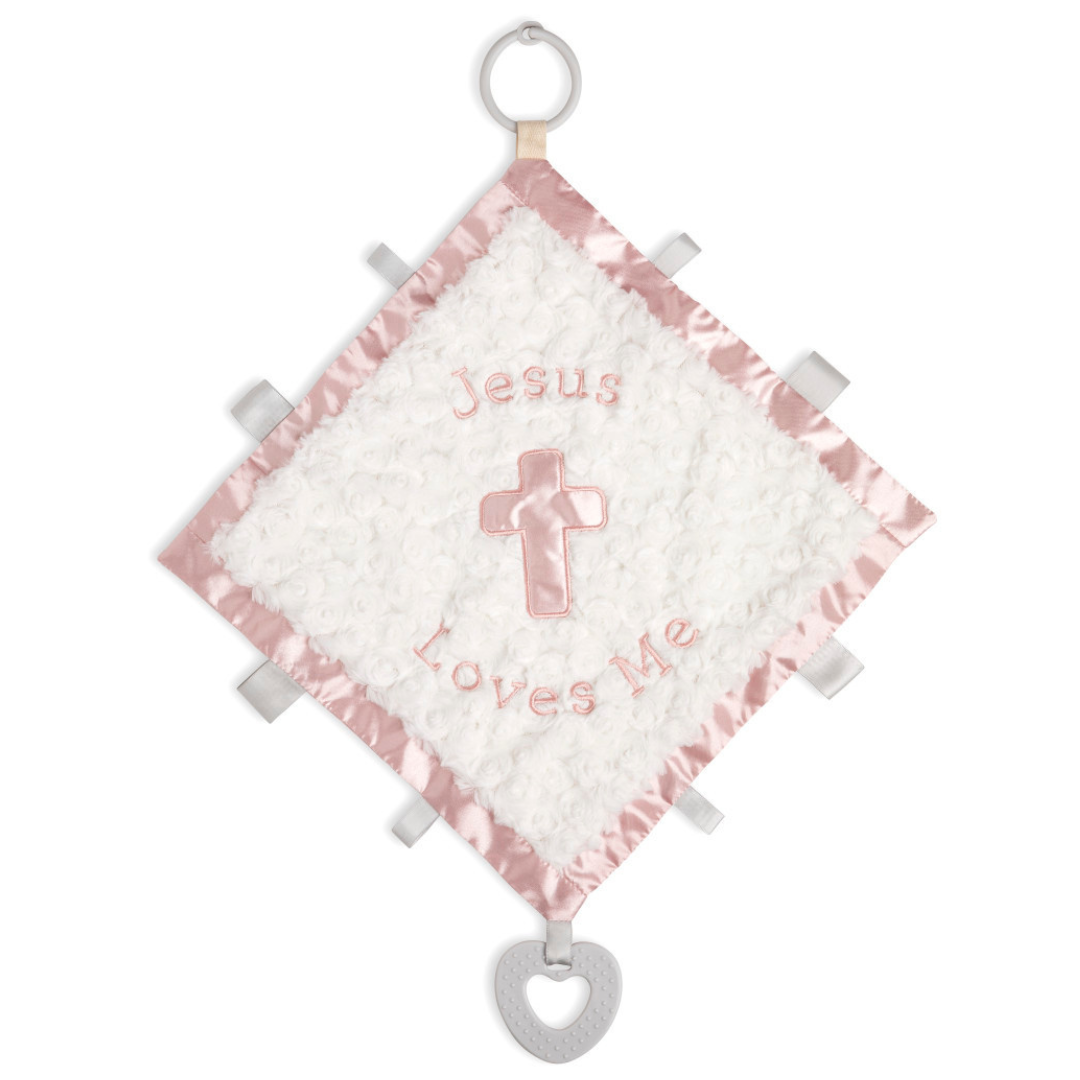 small white blanket teether with a pink silk trim and "jesus loves me" written in pink and a cross and plastic hook for hanging on stroller
