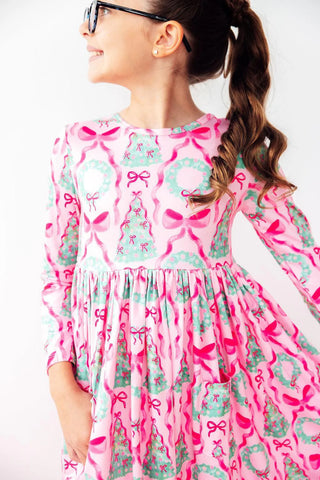 Girls' long sleeve twirl dress with scoop back and full-circle skirt in soft stretch fabric—ideal for school, play, and dress-up.