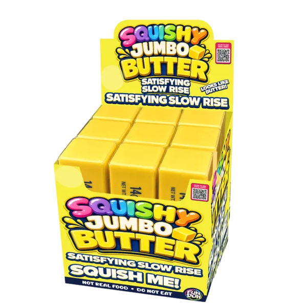 Jumbo yellow butter-shaped slow-rise squishy sensory toy displayed in retail packaging.