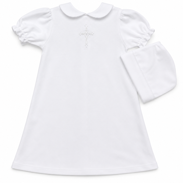 white knit daygown with hand embroidered cross on the front and a rounded collar. has a matching bonnet. 