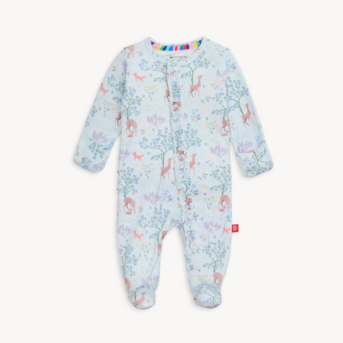 Baby wearing a soft TENCEL™ modal footie sleeper with magnetic closures and fold-over mittens for cozy, all-day comfort.