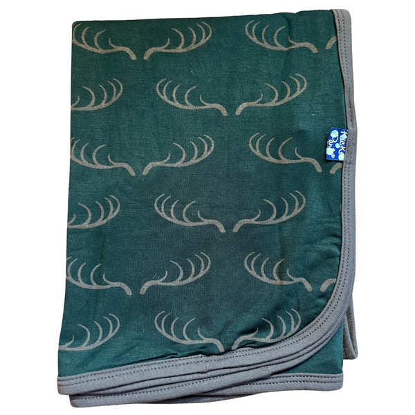 bamboo swaddle blanket dark green pine background with grey deer rack print