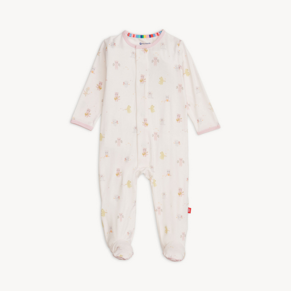 Baby wearing a soft TENCEL™ modal footie sleeper with magnetic closures and fold-over mittens for cozy, all-day comfort.