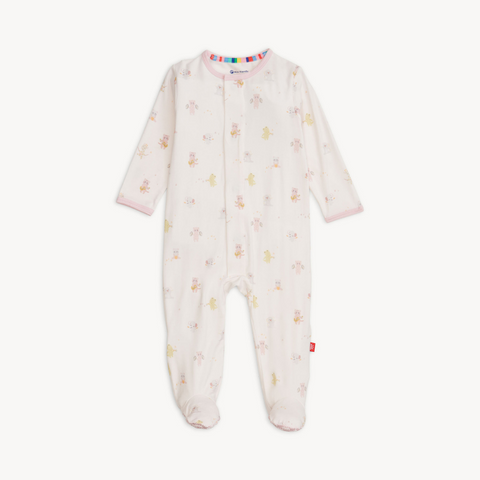 Baby wearing a soft TENCEL™ modal footie sleeper with magnetic closures and fold-over mittens for cozy, all-day comfort.