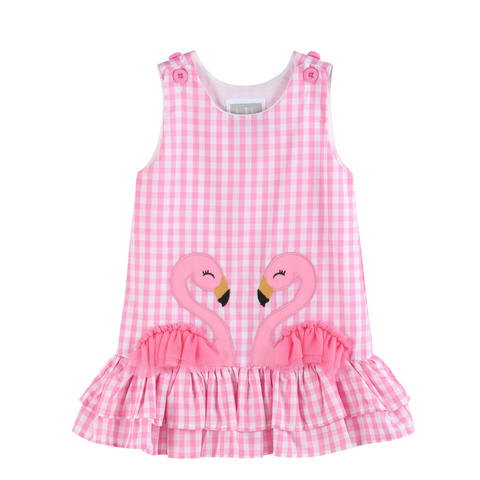 pink sleeveless gingham dress with two flamingos making a heart on the front with a ruffle bottom. 