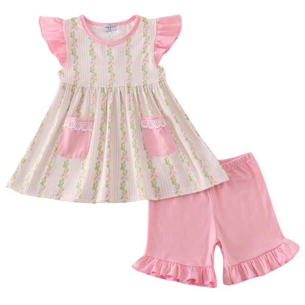 Two-piece girls' outfit with flutter sleeve lemon print top, lace-trimmed pink pockets, and matching ruffle-hem pink shorts.