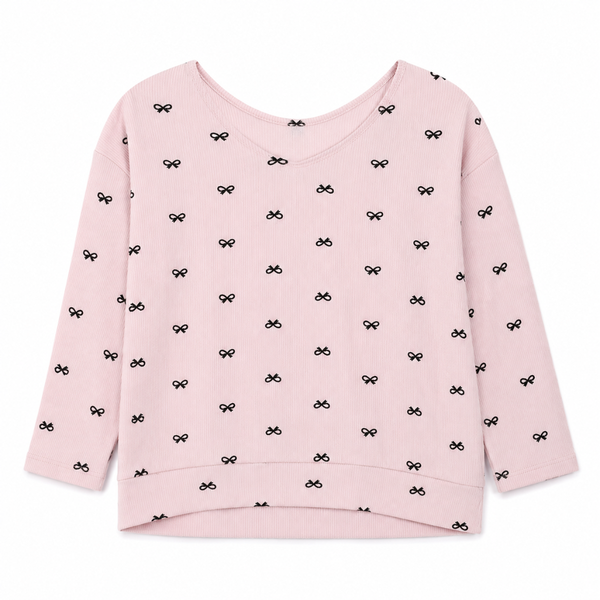 Girls pink ribbed sweatshirt with small black bow print and long sleeves on hanger