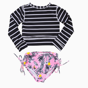 long sleeve swim rashguard in black and white stripe with tropical pink and black bottoms with palm tree, pineapple and bananas print