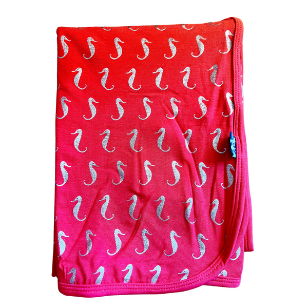 bamboo swaddling blanket in darker pink color with small  sparkle seahorse print