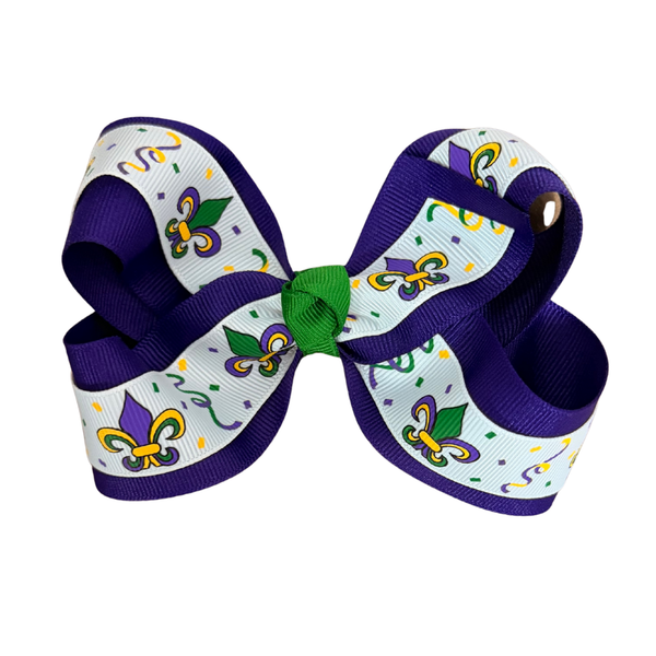 Purple Mardi Gras hair bow with fleur-de-lis and confetti print, green center knot, and attached silver alligator clip on back.