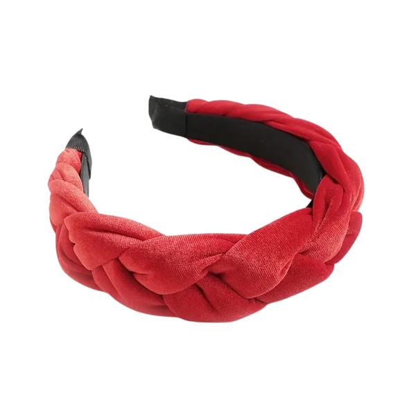 A vibrant red, wide velvet headband with a prominent braided design, padded for comfort, against a white background.