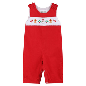 Front view of red velvet Christmas overalls for babies featuring festive smocking and bottom leg snap closures.