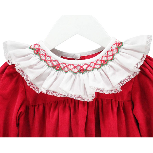 Detailed view of the white ruffle collar with red and green smocking and lace trim on the red dress