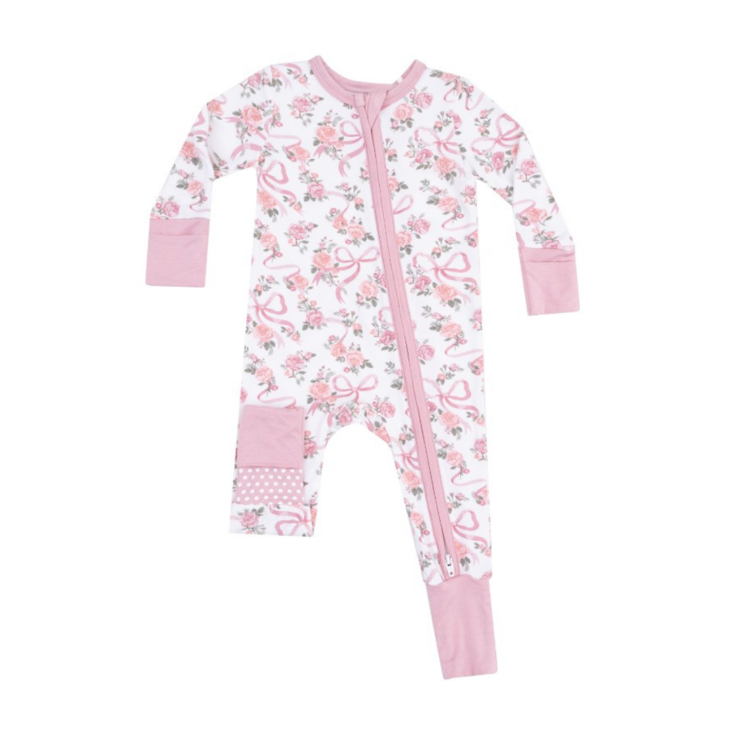 white coverall with pink roses and pink bows. 